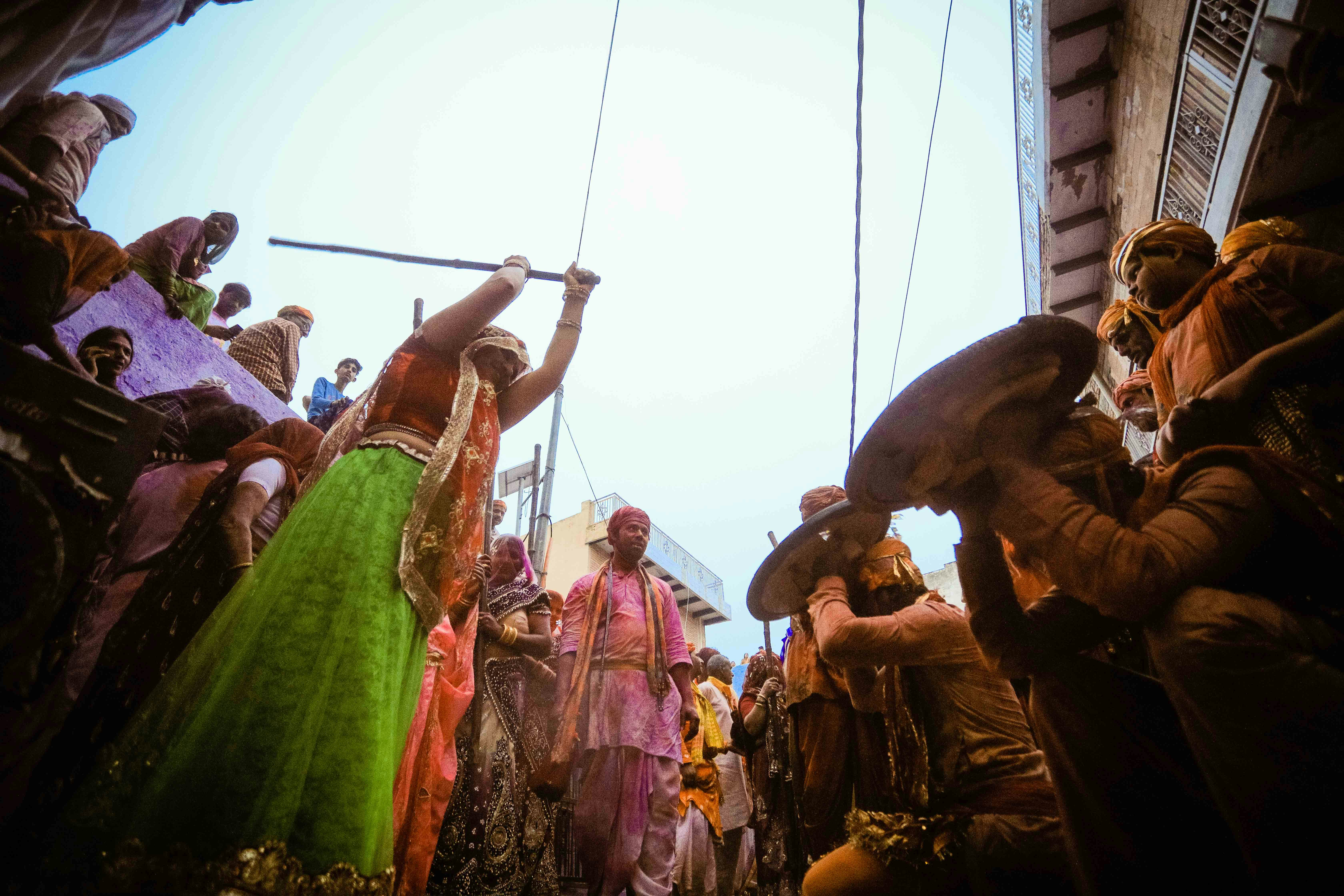 people in green shirt holding rope during daytime